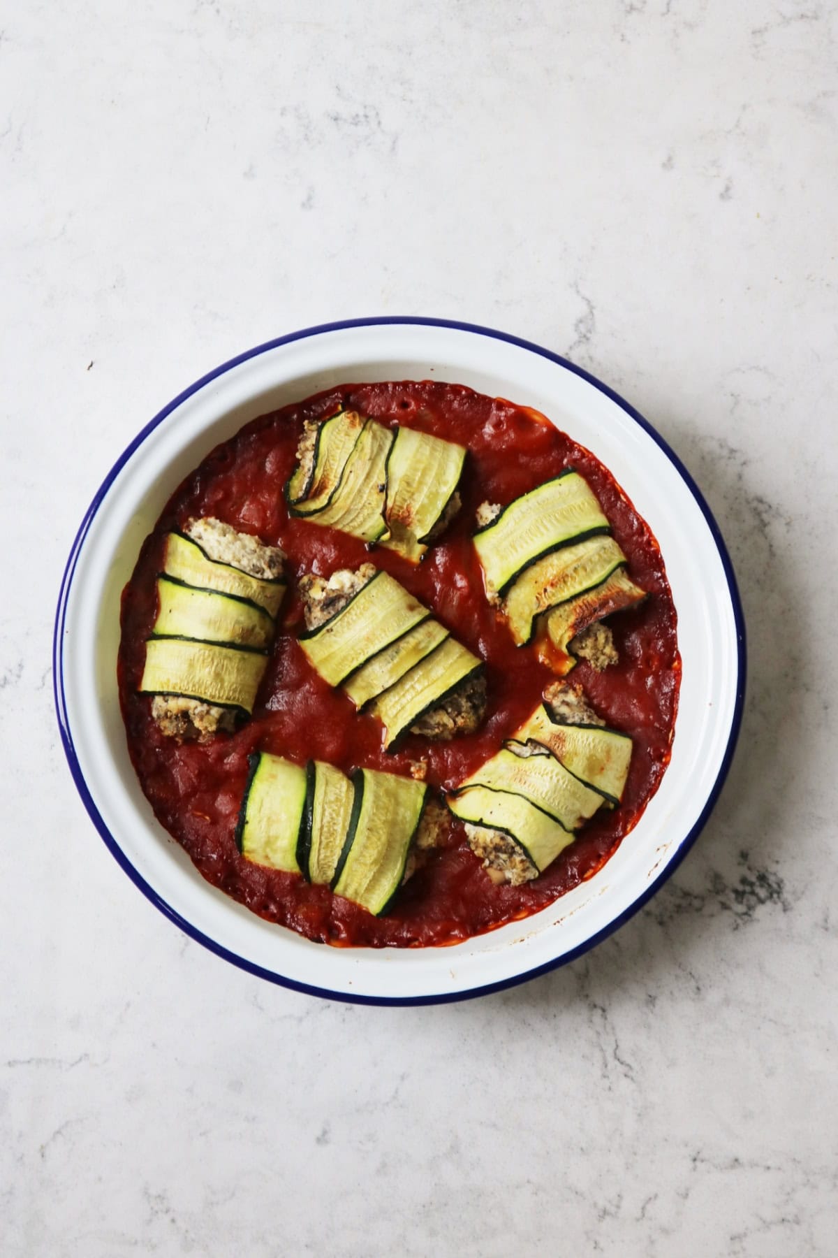 Baked Vegan Courgette and Mushroom Involtini in an oven dish