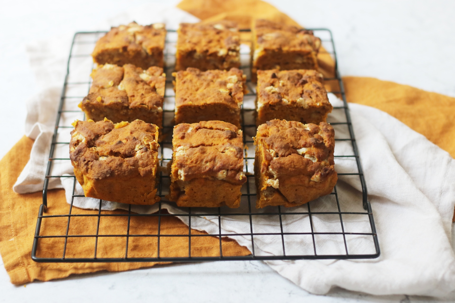 Vegan Pumpkin Spice Blondies cooling on a wire rack