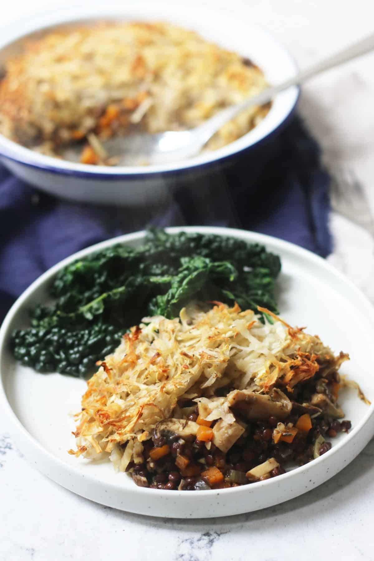 Rösti-Topped Puy Lentil and Mushroom Pie plated up with cavolo nero