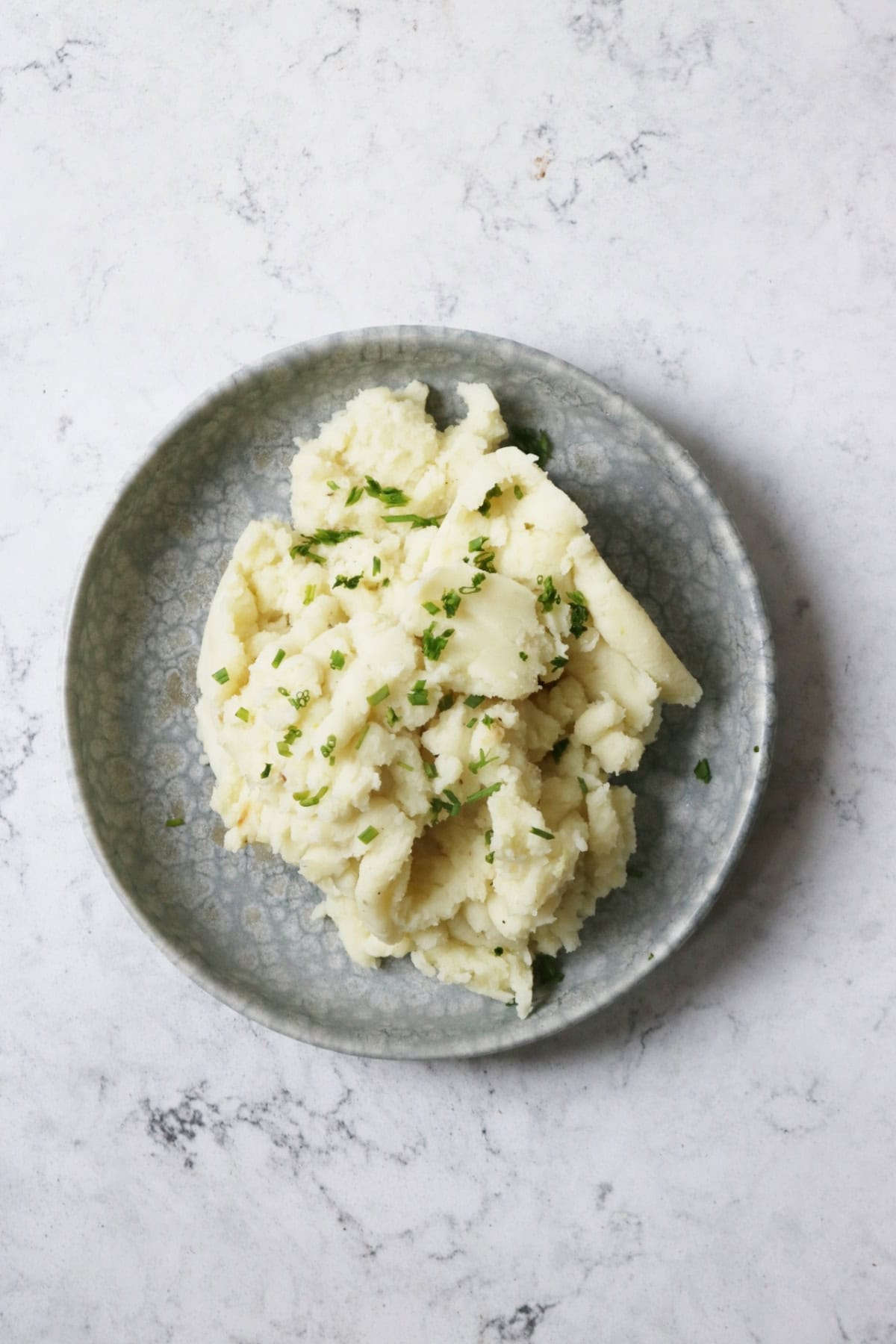 Vegan Garlicky Mashed Potatoes with Chives on a plate