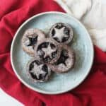 Vegan Chocolate and Cherry Mince Pies on a plate with a red napkin