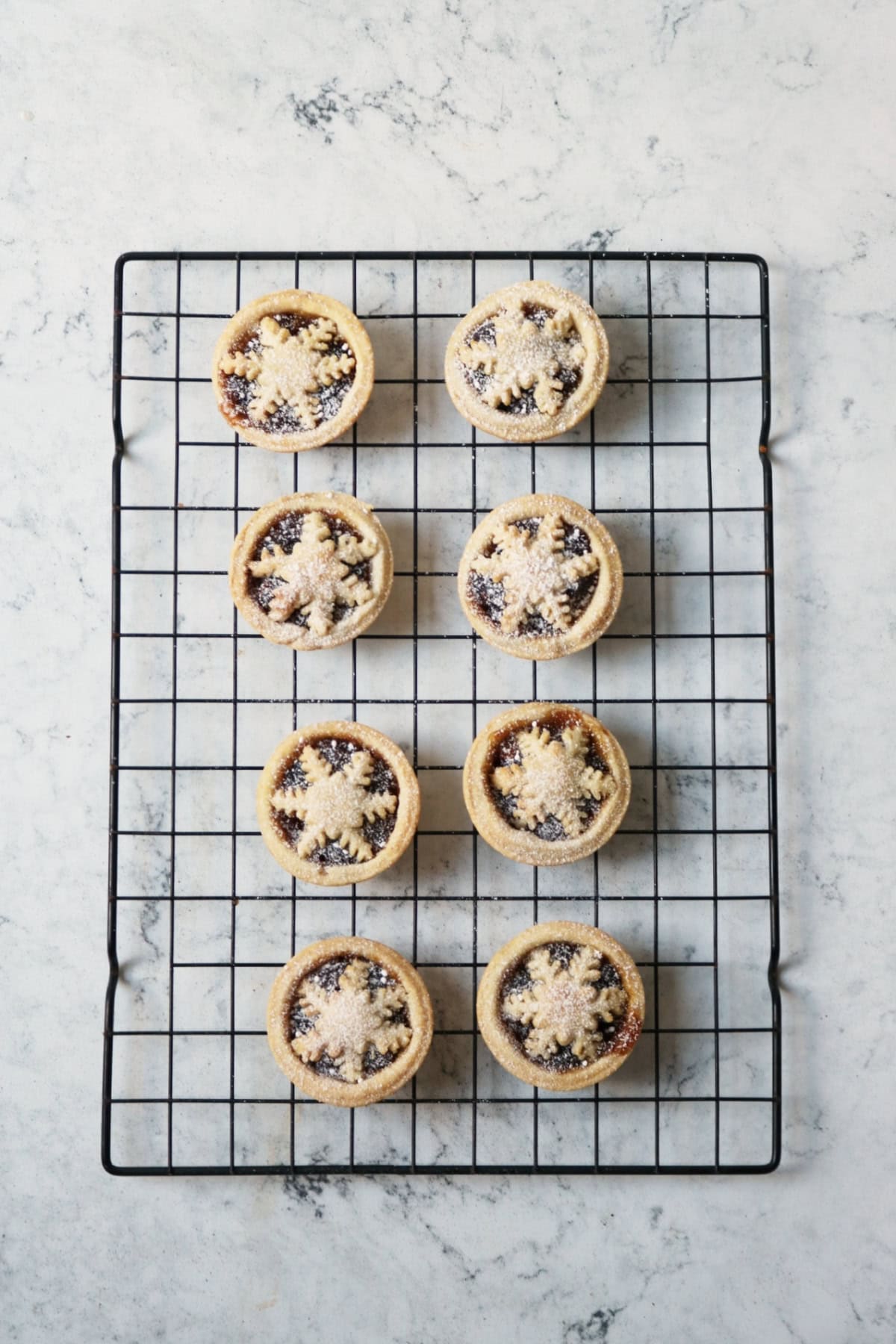 8 mince pies cooling on a wire rack
