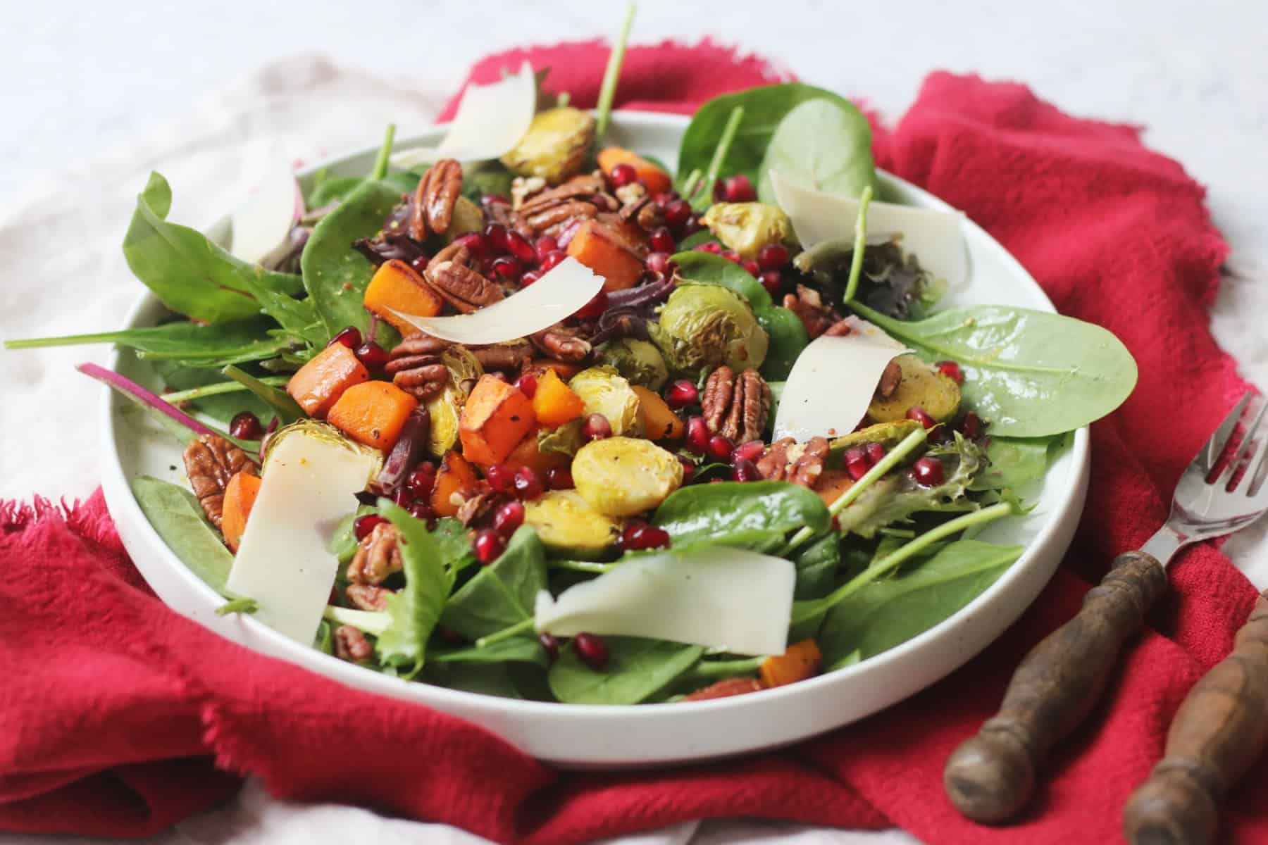 Festive Salad on a large white plate on top of a red napkin