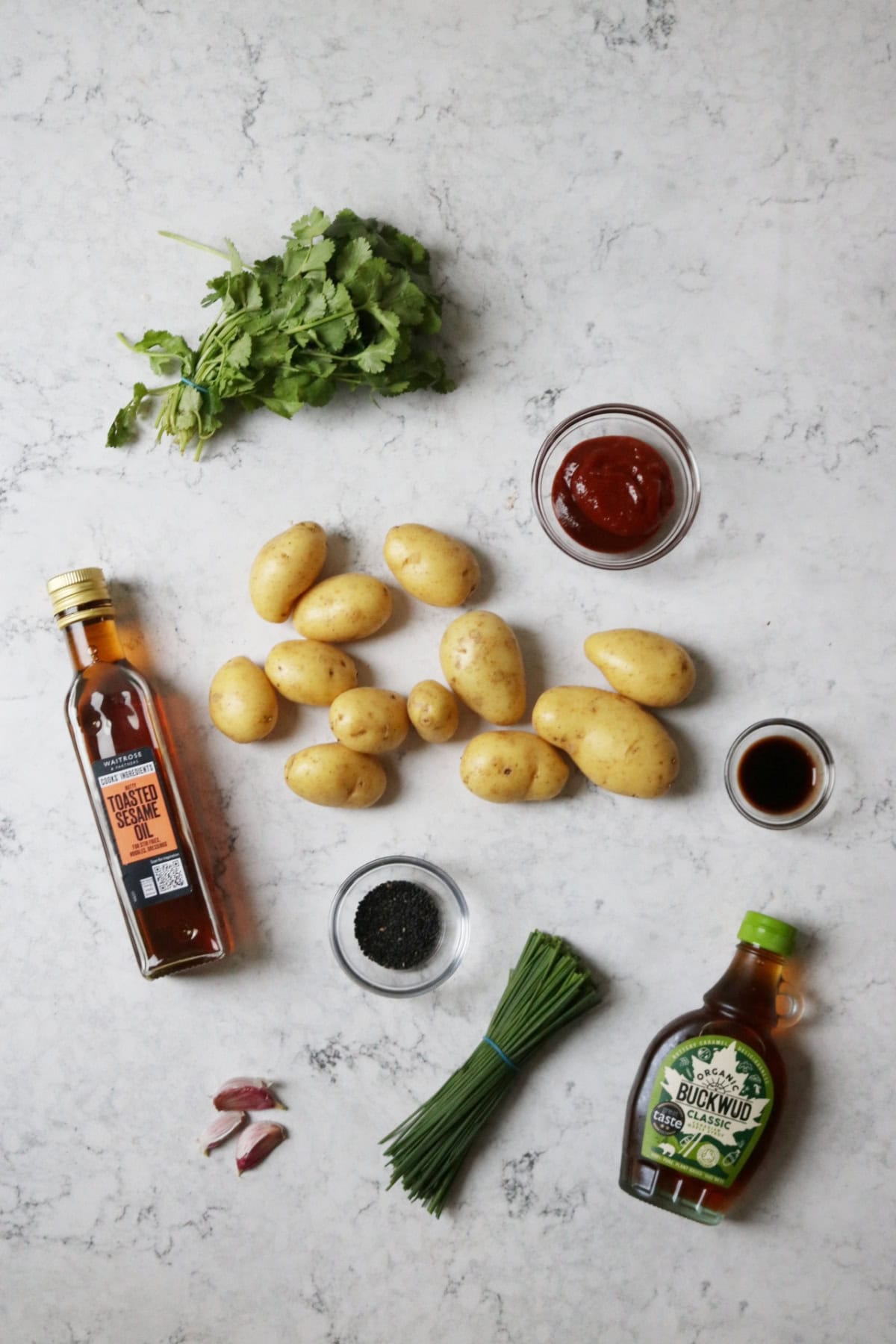 Coriander, gochujang, sesame oil, potatoes, sesame seeds, garlic, chives, maple syrup