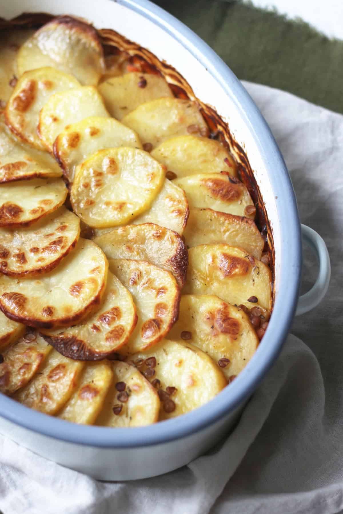 Close up of the potato slices on top of a Vegan Lancashire Hot Pot