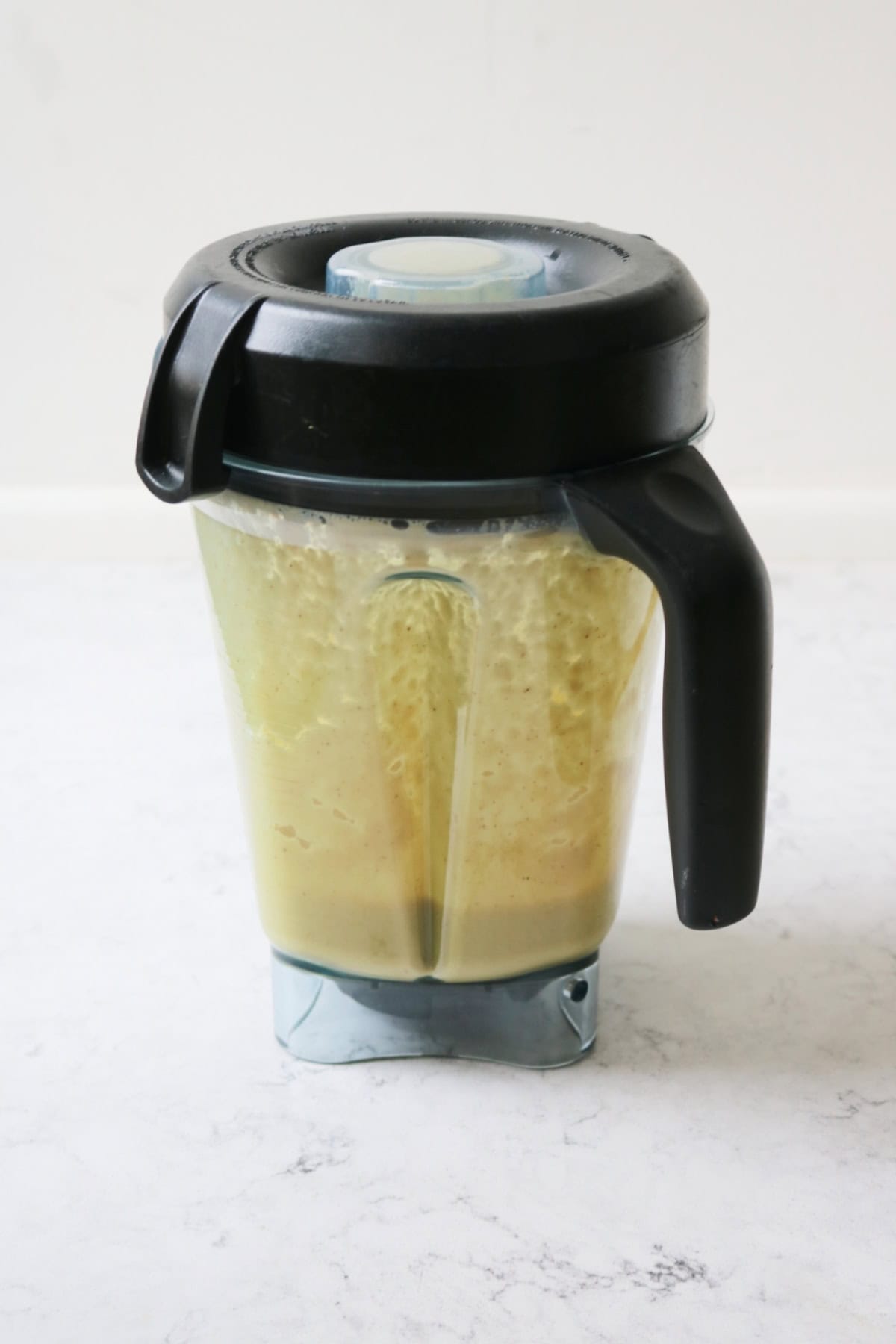 A blender containing blitzed up cauliflower broth