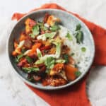 Vegan Gochujang Vegetable Traybake served with rice noodles and coriander