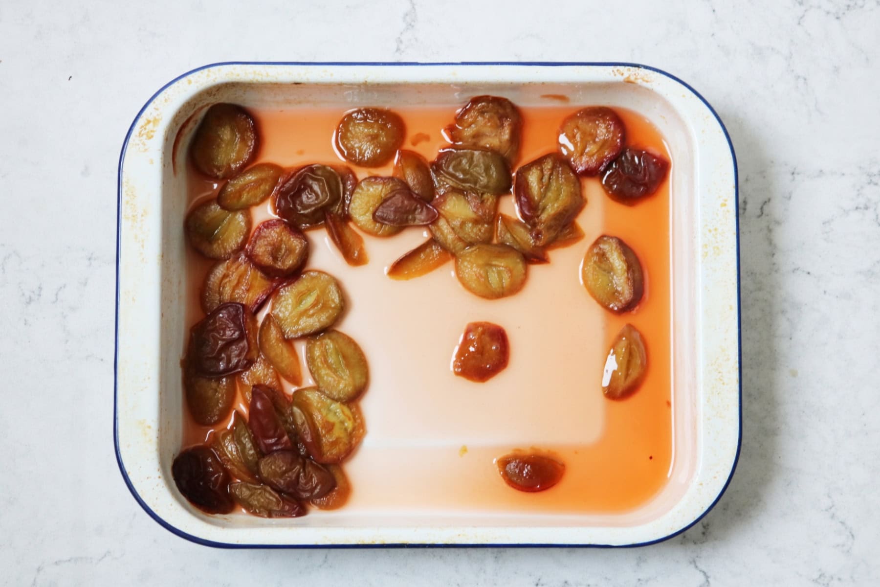 A tin of roasted plums in syrup.