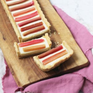 A close up of slices of a rectangular Vegan Rhubarb and Custard Tart