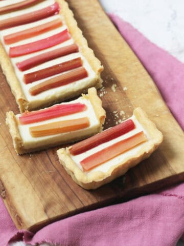 A close up of slices of a rectangular Vegan Rhubarb and Custard Tart