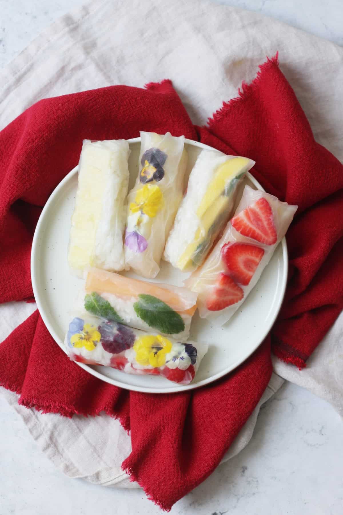 A platter of Vegan Sweet Summer Rolls on a red napkin