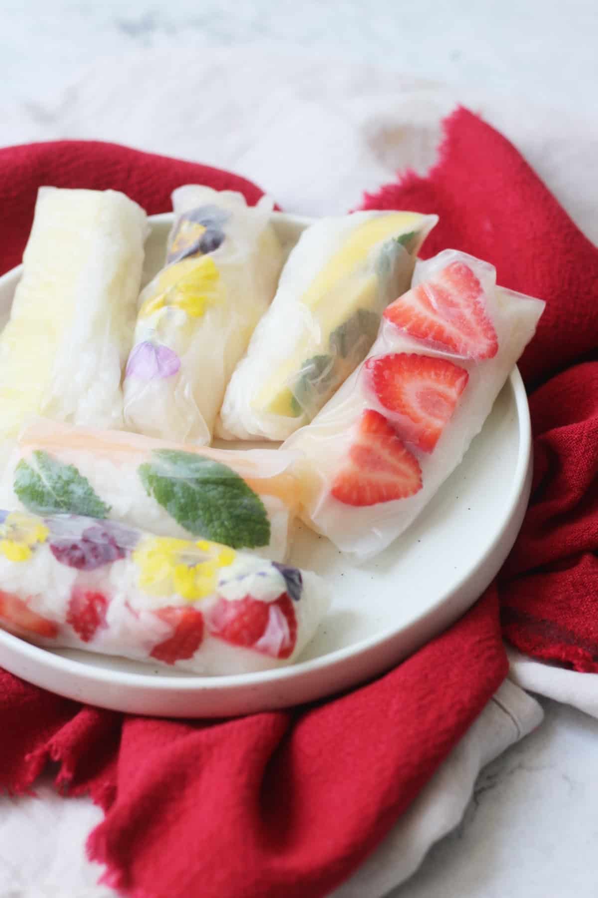 A platter of Vegan Sweet Summer Rolls on a red napkin