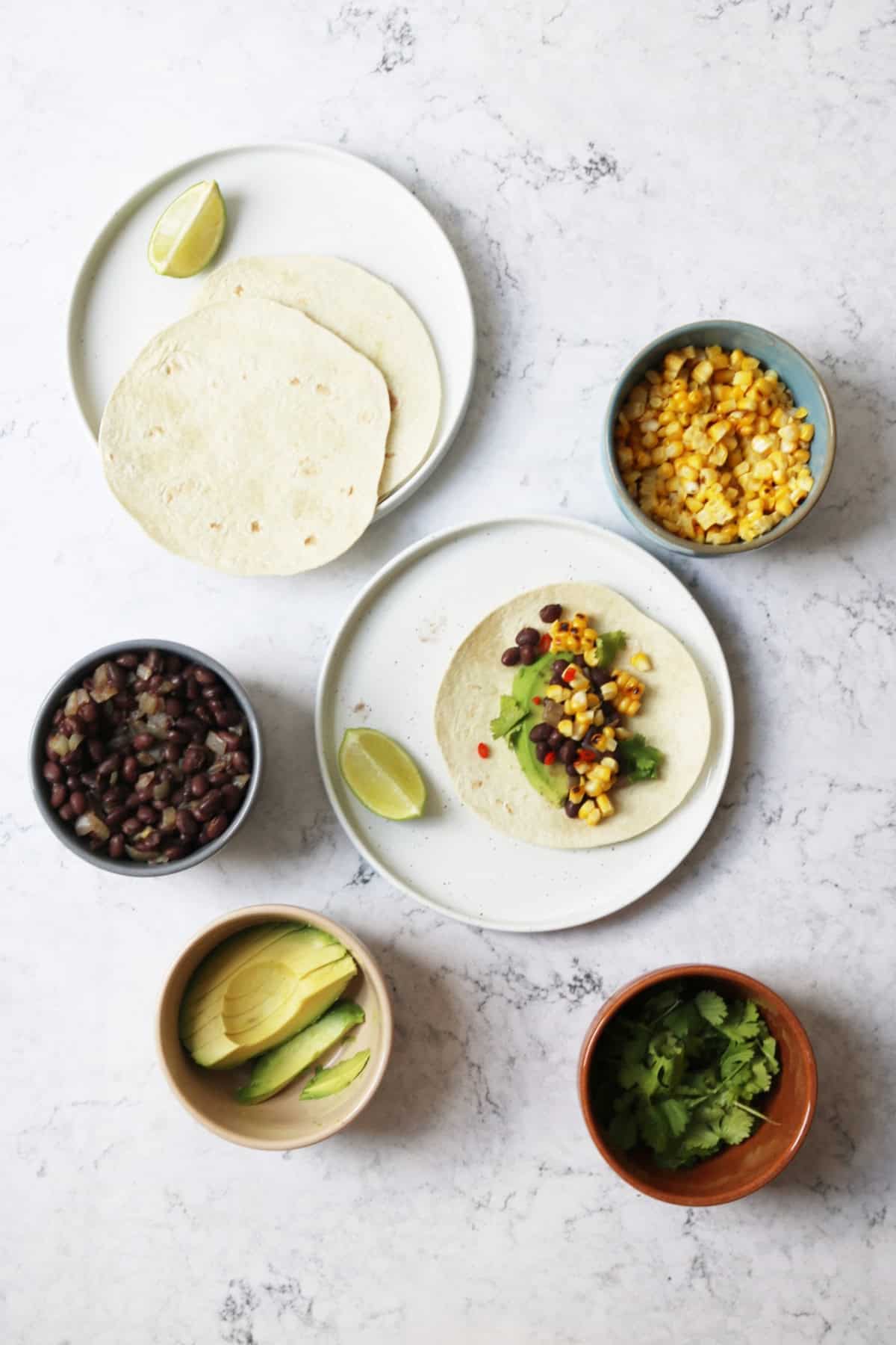 The component parts of Vegan Corn and Black Beans tacos ready for assembling