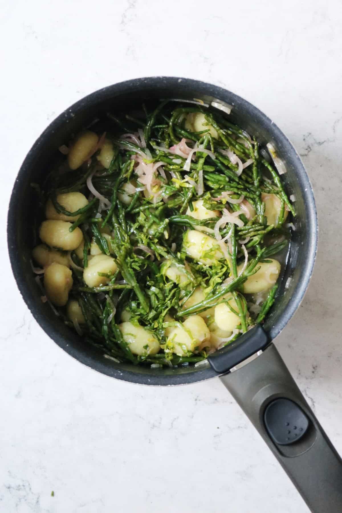 A pan of Vegan Samphire Gnocchi cooking gently