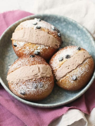 Three Vegan Chocolate Maritozzi on a plate