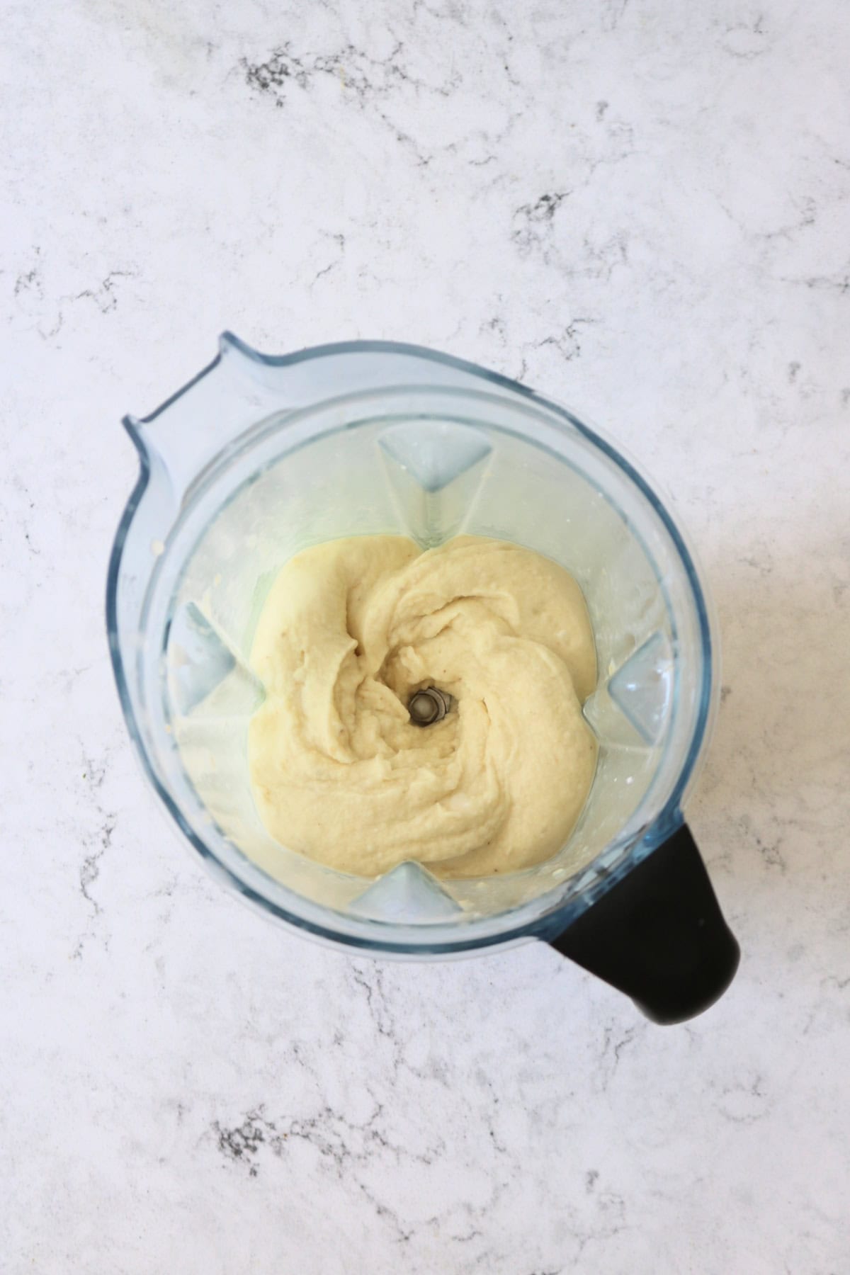 Vegan Banana and Coconut Ice Cream being blitzed in a blender