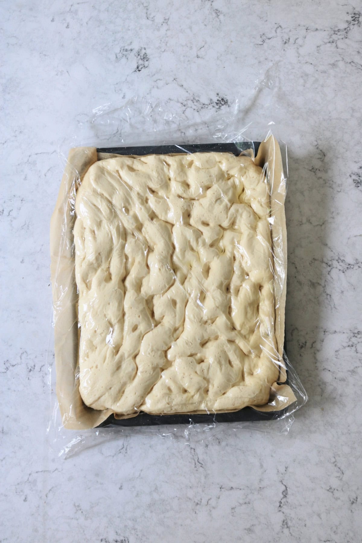 Green Olive and Za'atar Focaccia dough all puffed up after proving for the second time