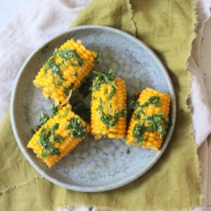 4 corn on the cobs smothered in a herby butter made from vegan butter, coriander, parsley and roasted garlic.