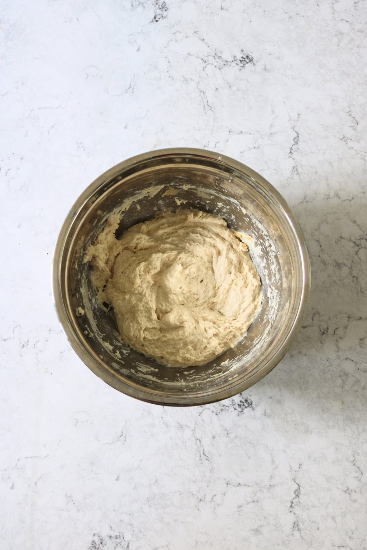 A shaggy ball of focaccia dough before being kneaded