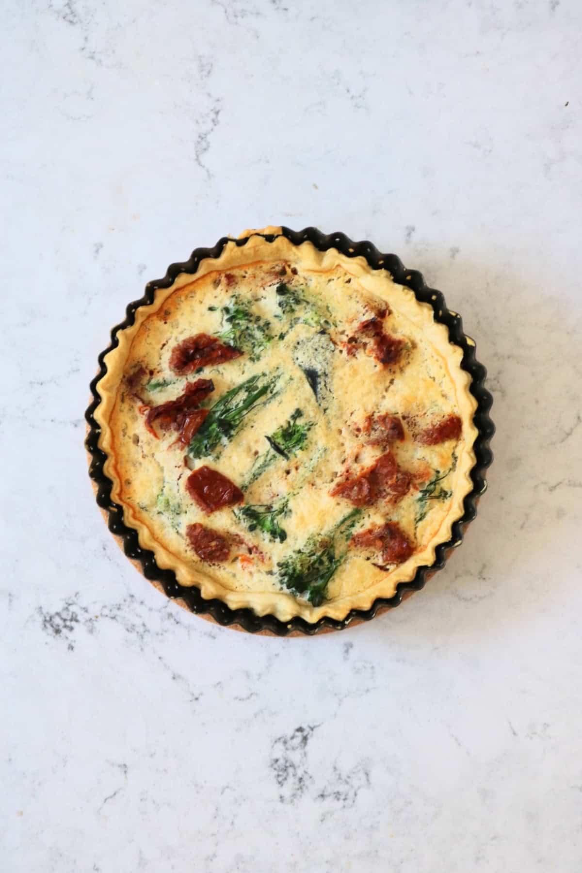 A baked Vegan Tenderstem Broccoli and Sun-Dried Tomato Quiche