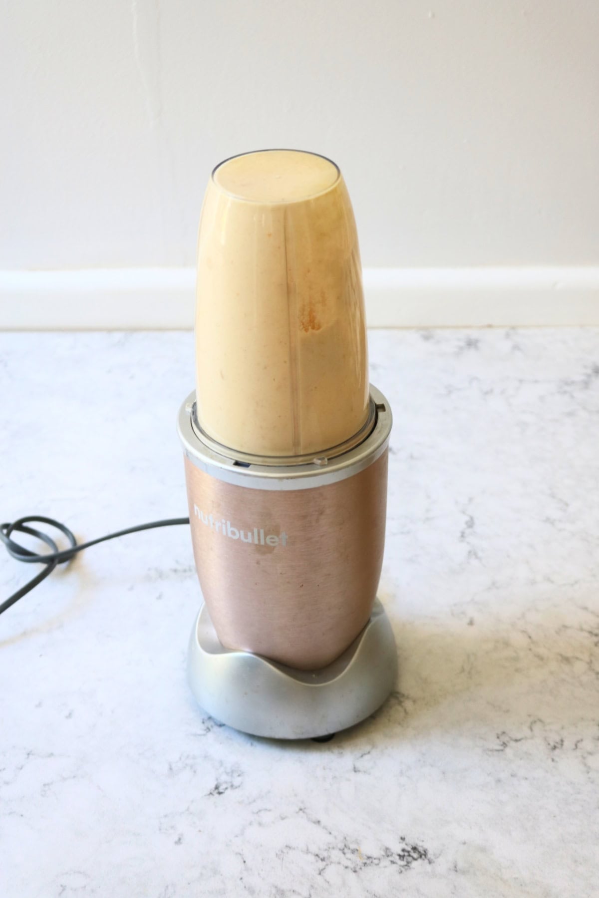 Vegan creamy courgette linguine sauce being blitzed in a Nutribullet