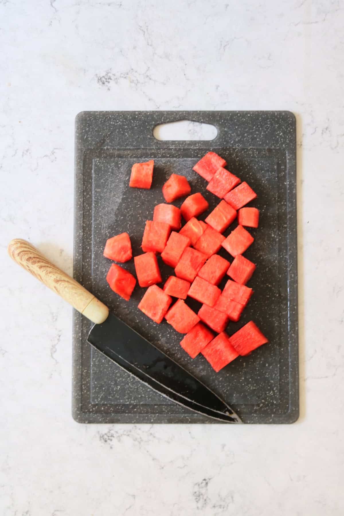 A watermelon cut into cubes with the seeds removed