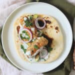 2 Vegan Tofu Kofta with mint yogurt, red onion and baby courgettes served on a flatbread