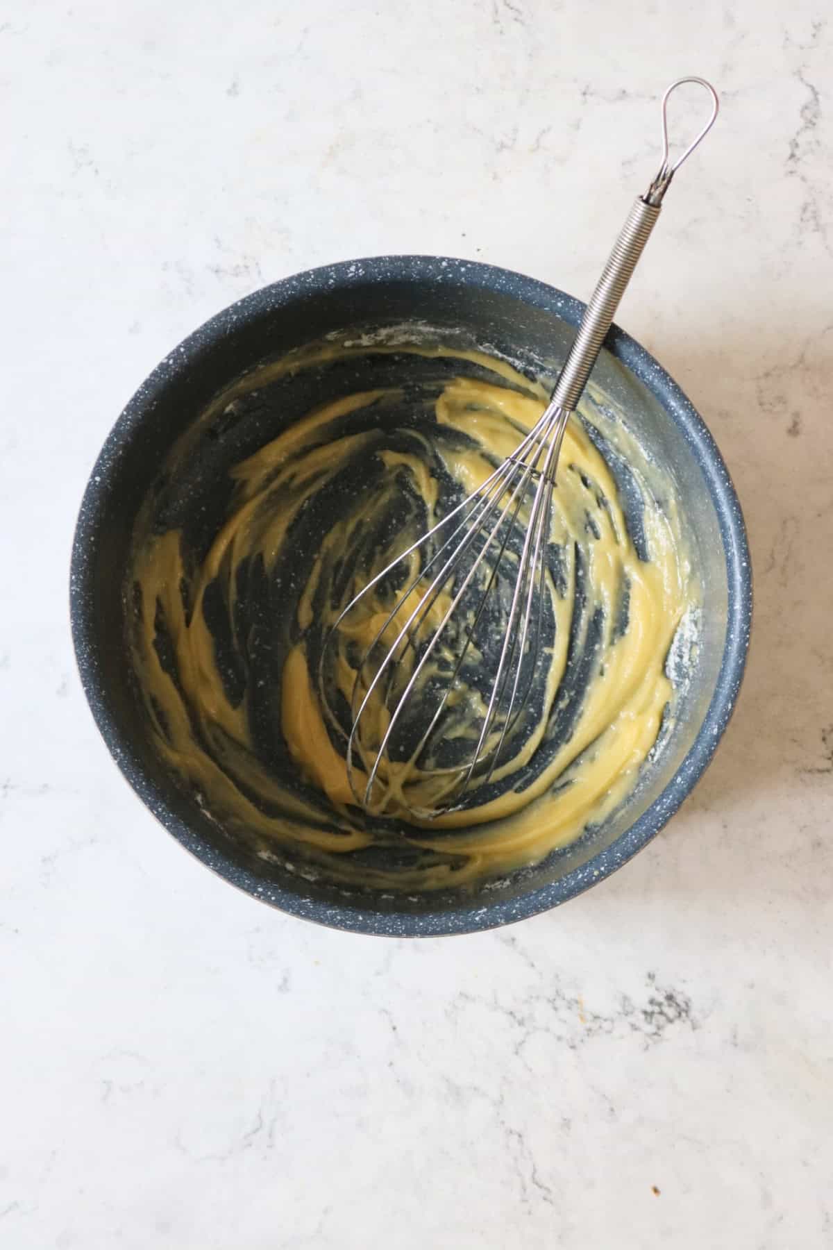 Making a roux in a medium sized saucepan with a metal whisk