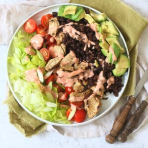 Vegan Chicken and Avocado Salad with Black Beans and a Smoky Paprika Yogurt Dressing drizzled over the top