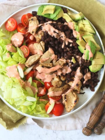 Vegan Chicken and Avocado Salad with Black Beans and a Smoky Paprika Yogurt Dressing drizzled over the top